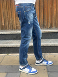 JEANS DENIM BLU CON DETTAGLI DISTRESSED TELAMIRA